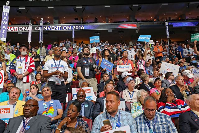 People either seated or standing at the 2016 Democratic National Nominating Convention at the Wells Fargo Arena in Philadelphia, Pennsylvania.